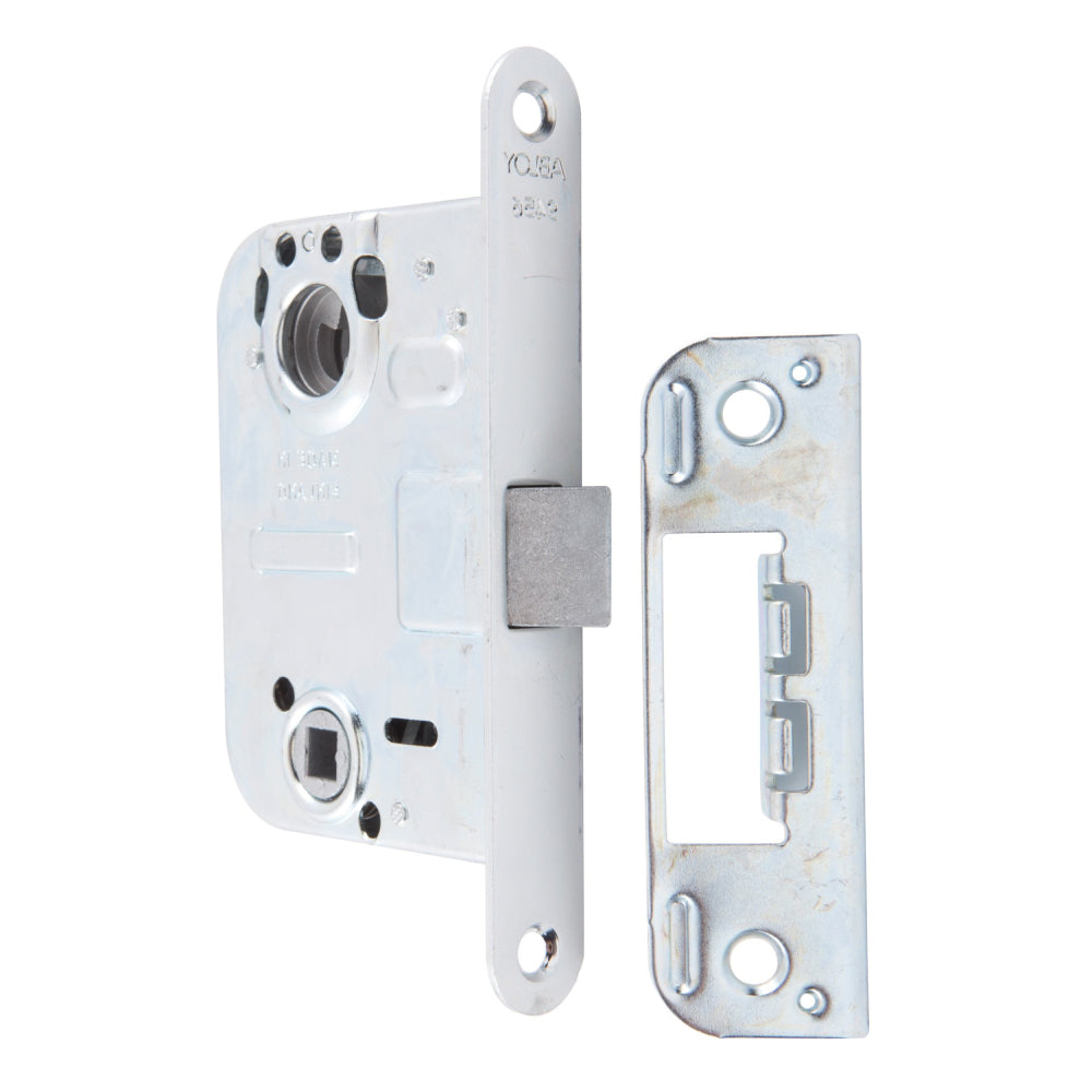 Låshus 9456 höger från ASSA ABLOY är ett cylinderlås för mellandörrar. Genom att vrida nyckeln eller vredet skjuter fallkolven ut och förreglas vid 20 mm. 
